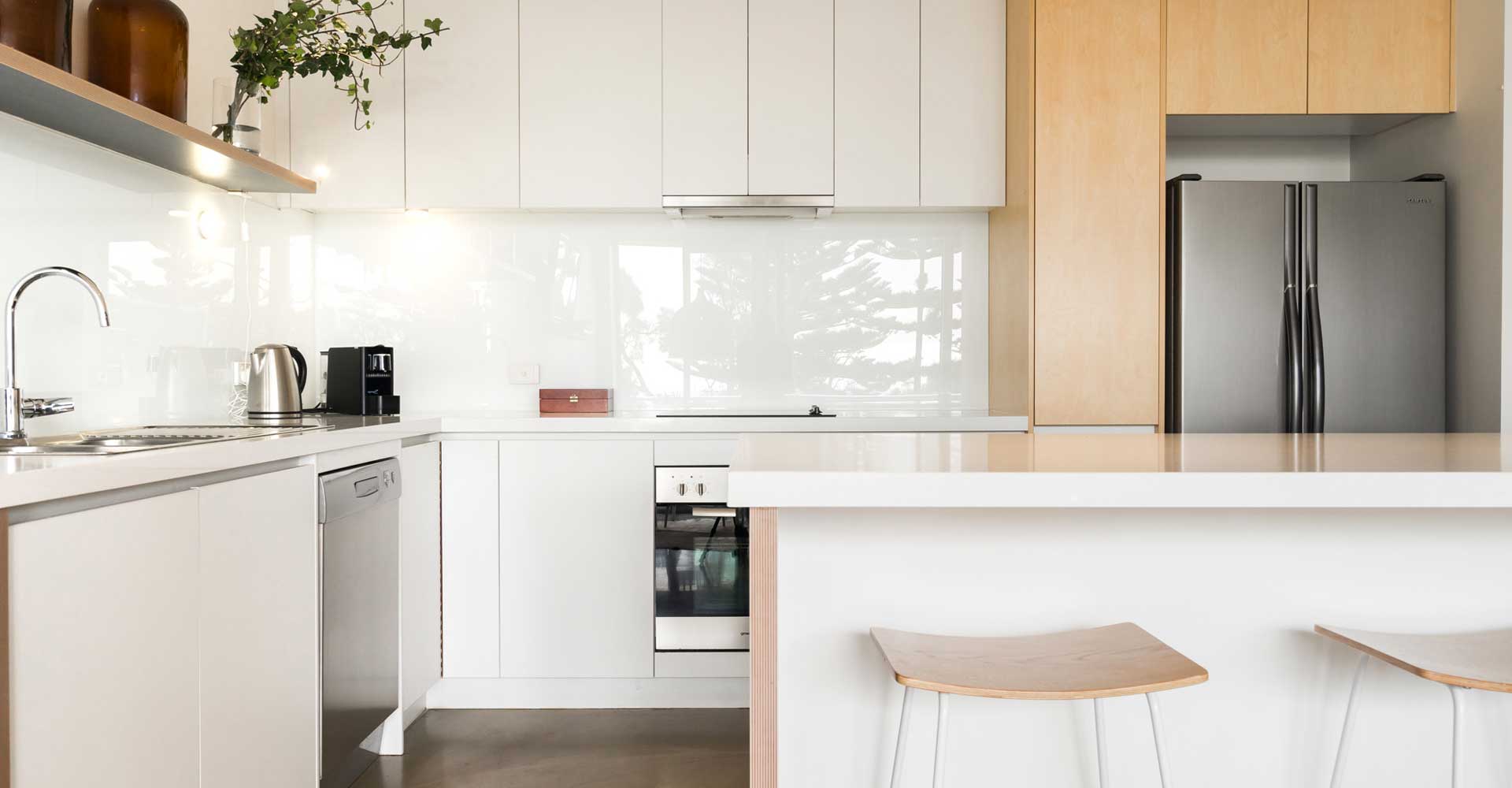 Home renovation with Modern white kitchen design built by Peninsula Building Projects on the Mornington Peninsula